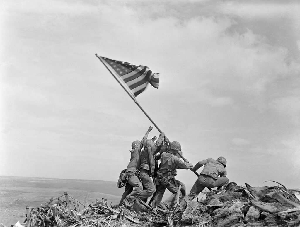 Soldiers raising American flag at Iwo Jima